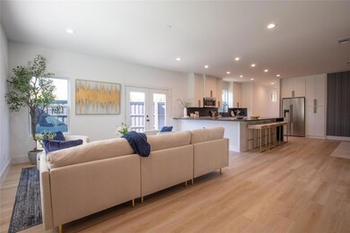 Living room with light hardwood / wood-style floor