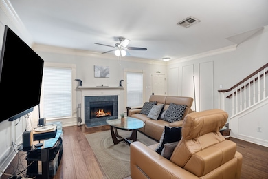This charming unit has wood floors throughout the space, crown molding, wainscotting, and an inviting fireplace.  Double paned windows help keep your energy bills low!