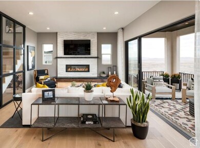 Living area with light wood finished floors, a fireplace, and recessed lighting