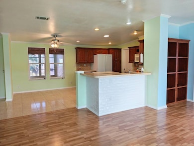 Living Room into Dining Area and Kitchen