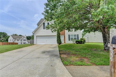 View of front of house with concrete driveway and 
