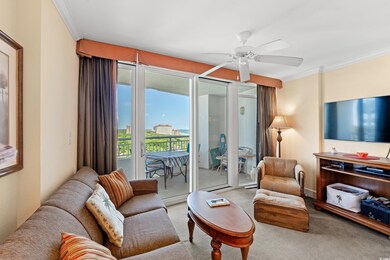 Carpeted living room featuring ornamental molding 