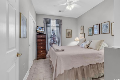 Tiled bedroom with ceiling fan