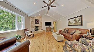 Fabulous family room with beam ceiling and firepla