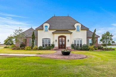 Front view of home with beautiful landscaping.