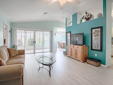THIS LIVING AREA HAS EQUISITE LIGHT LAMINATE FLOORING!