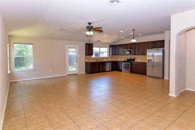 Kitchen featuring appliances with stainless steel
