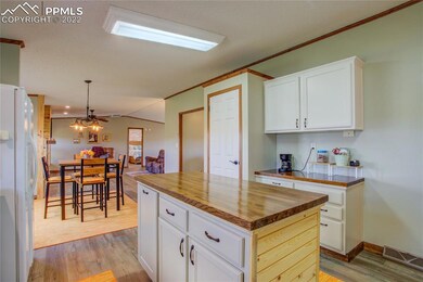 Kitchen has pantry and coffee bar.