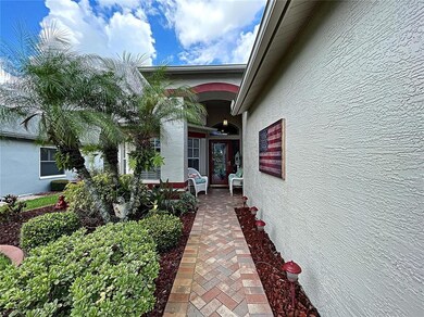 Pavered walk leads to covered front patio