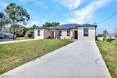 View of front facade featuring concrete driveway,