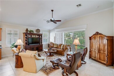 Freshly painted Living room with plantation shutters and crown molding