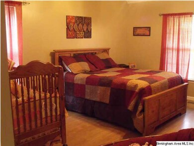 Master bedroom with wood floors.