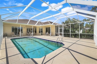 Swimming pool featuring a patio, ceiling fan, and glass enclosure