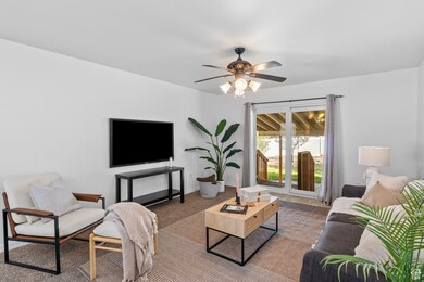 Family room off the kitchen area with backyard covered patio entrance