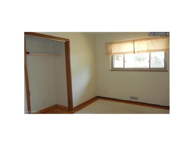 Office or small family room with hardwood flooring