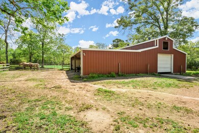 Recently painted barn equipped with 2 stalls, feed & tack rooms, large covered area for tractors, atvs and equipment.