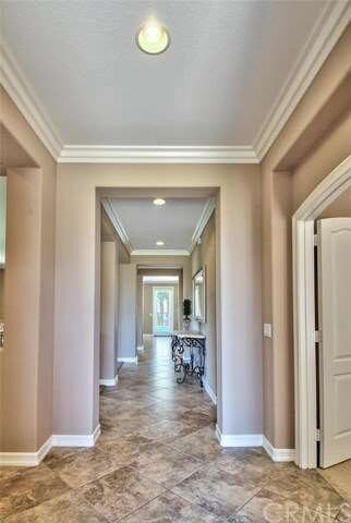 Open feeling Foyer with Crown Molding.