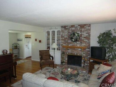 Living room fireplace with China cabinet