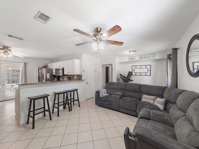 Open fee flow living area into the kitchen and breakfast area complimented by access to backyard.