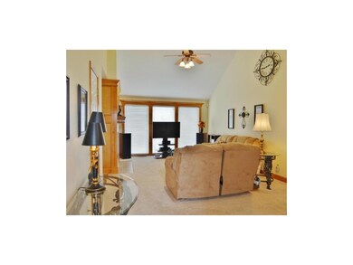 The great room features vaulted ceilings, fresh ca