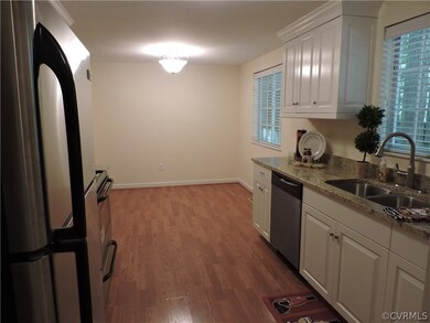Eat-in Kitchen has new lighting and custom blinds