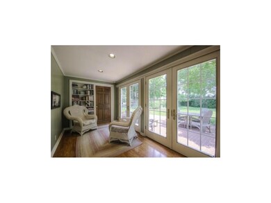 Sun Room/ 2 Pella French Doors Leads to A Large Br