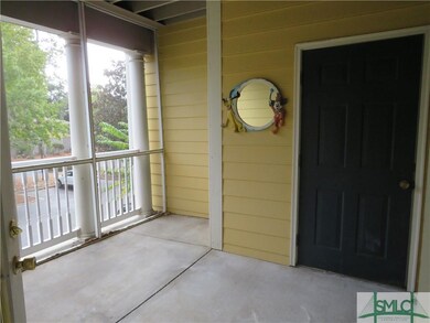 Screened porch with utility closet and door to mas
