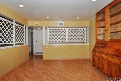 Family room is open to kitchen and features custom