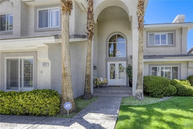 View of exterior entry with french doors and stucco siding