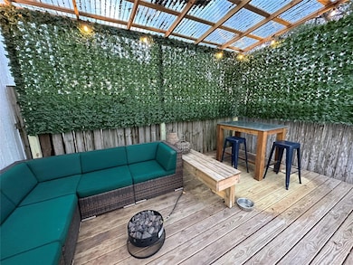 Wooden deck featuring a pergola, outdoor lounge a
