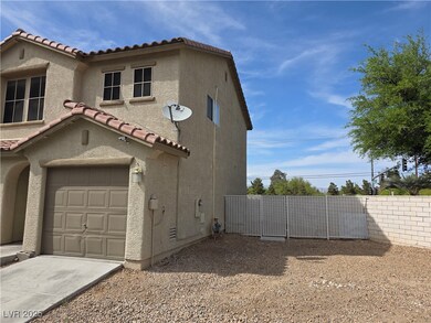 View of home's exterior with concrete driveway, fe