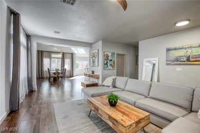 Living area with dark wood-style flooring
