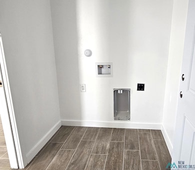 Laundry room with wood tiled floors, hookup for a washing machine, and electric dryer hookup