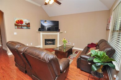 A cozy gas log fireplace highlights the family-siz
