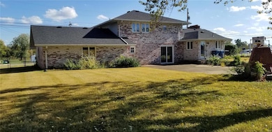 Large fenced backyard with spacious concrete patio.