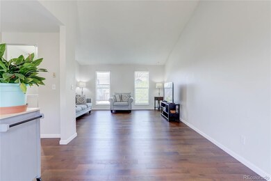 Dining room features vaulted ceiling and fan for c