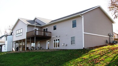 Rear View Of Home & Backyard