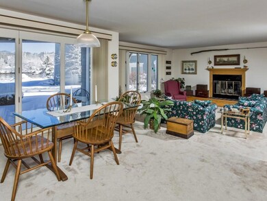 step down into living room with wood...
