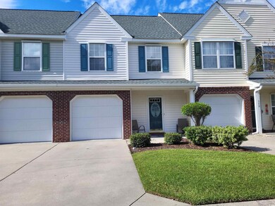 Townhome / multi-family property with roof with sh