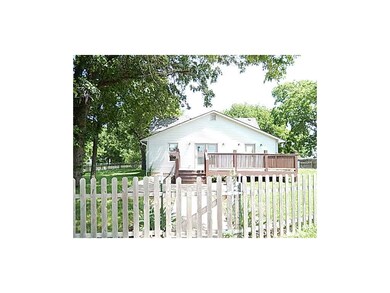 Large wood deck off of the kitchen and around to t