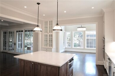 Open floor plan with kitchen opening to dining roo