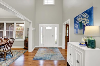 Stunning Entryway with Hickory Hardwood Flooring & Cathedral Ceilings
