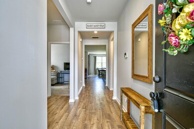 Foyer featuring wood finished floors and baseboards
