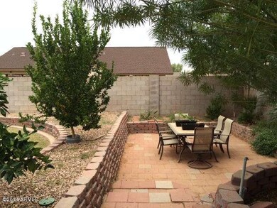 Lowered backyd. space for entertaining.
