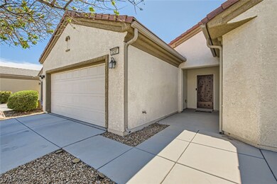 Garage featuring concrete driveway
