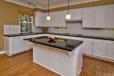 Spacious kitchen with breakfast countertop.