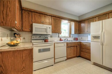 Kitchen with quite a lot of nice wood cabinets!