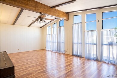 Unfurnished living room with vaulted ceiling with