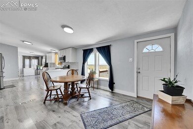Dining room featuring baseboards and light wood finished floors