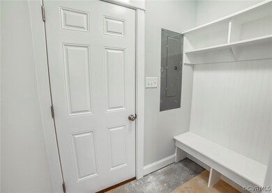 Garage entry with mudroom bench.